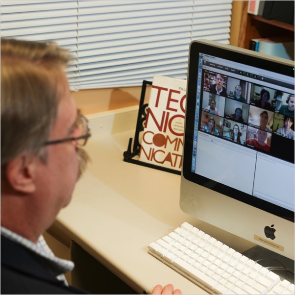 Students communicating with instructor remotely via their PCs in a live, fully online class.